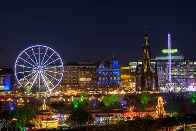 christmas lights 2016 in edinburgh's princess street gardens with the sir walter scott monument. scotland, uk