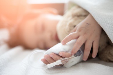baby girl sick in hospital, saline solution intravenously.