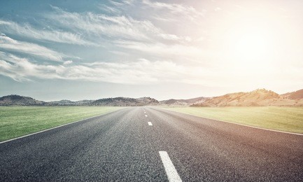 natural summer landscape with asphalt road to horizon