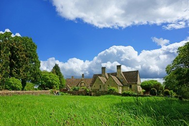 quaint individual cotswold country cottages in the heart of the cotswolds on a beautiful summer day, painswick, gloucestershire, england, united kingdom