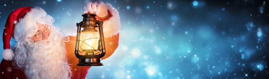 santa claus with lantern in snowy night
