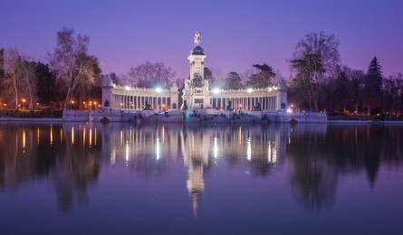 night cityscape with lights at retiro, madrid, spain