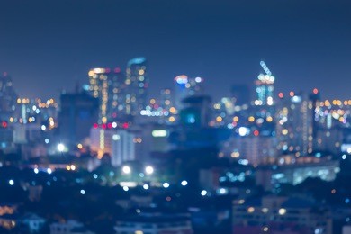 night blurred bokeh light city office building, abstract background 