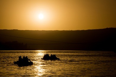 rafting during sunset, yellow river, shapotoou, china 