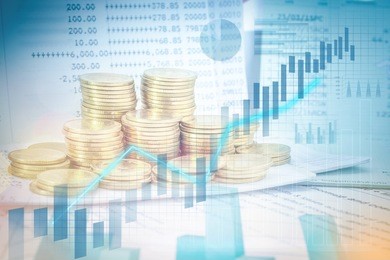 stacks of gold coins on banking account in the background,color filter,graphs and charts