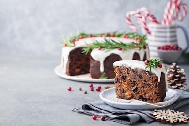 christmas fruit cake, pudding on white plate. copy space. 