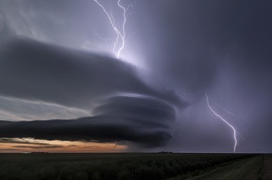 amazing supercell lighted up by lightnings at dusk