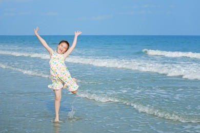 happy little girl on the beach
