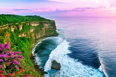 view of uluwatu cliff with pavilion and blue sea in bali, indonesia