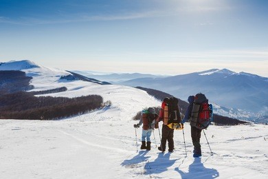 hiking in winter mountains. people traveling and sport concept