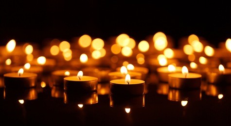 many burning candles with shallow depth of field