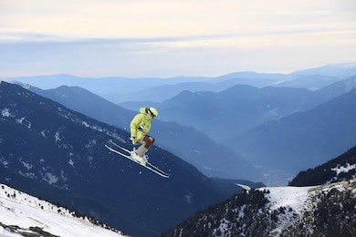 ski rider jumping on mountains. extreme ski freeride sport.
