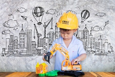 little engineer plays with toy,concept of a small creative engineer.