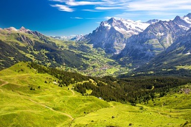 panorama view to grindelwald from mannlichen with eiger, monch and jungfrau mountain (swiss alps) in the background, berner oberland, grindelwald, switzerland.