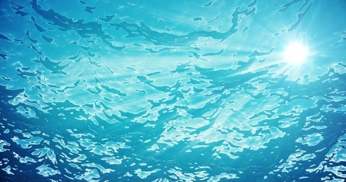 3d rendering underwater sea, ocean surface with light rays, high resolution