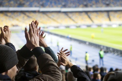 hand fans who clap their hands at the stadium