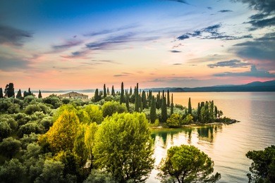 a beautiful sunset over the lake garda. italy.