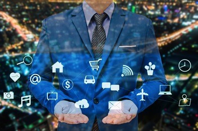 businessman in blue suite with technology in hand control the world , internet of things concept