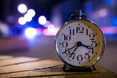 retro alarm clock with vintage efect at night on the street
