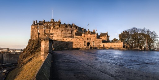castle of edinburgh on a cold autumn morning. front gate panoramic view. city on the background