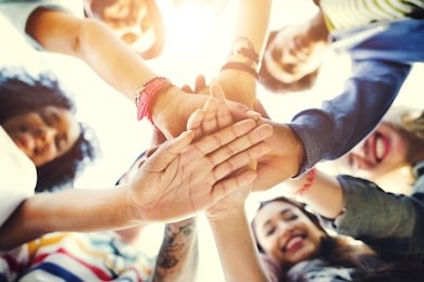 college students teamwork stacking hand concept