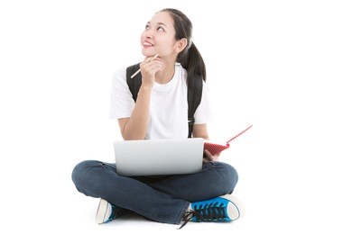 woman student sitting with laptop isolated on white background.