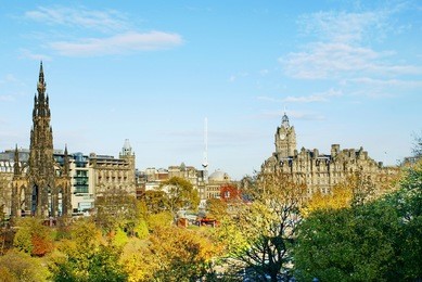 scott monument and the balmoral hotel in princes street park in edinburgh, scotland