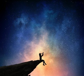 businesswoman against starry sky . mixed media