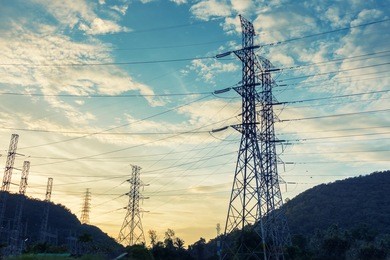 high voltage towers on skies background, transmission line tower.