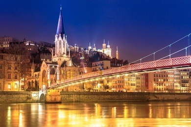 view of saone river, famous church in lyon city at evening, france.