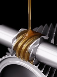 oiling worm gear closeup 3d illustration on black background