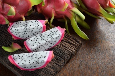 healthy dragon fruits on rough old wood and brown background