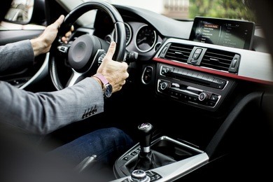 young man driving in the  modern car