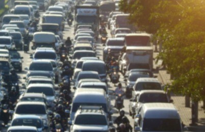 blurred traffic jam in bangkok road with sunlight.