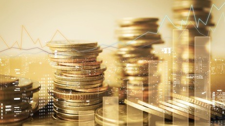 double exposure of graph and rows of coins for finance and business concept