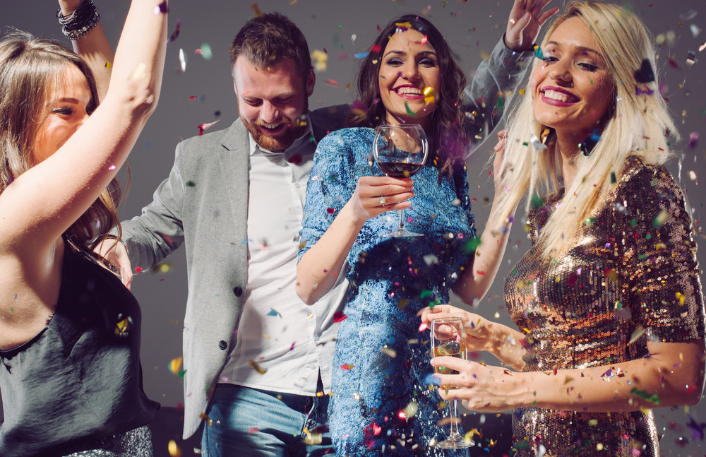 people dancing and having fun at home party.