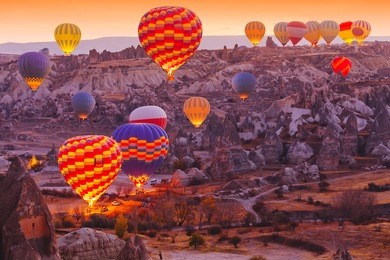 beautiful vibrant colorful balloons in sunrise light in cappadocia.