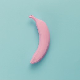 pink banana on blue pastel background. minimal style. flat lay. food concept.