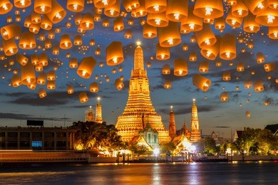 floating lamp in yee peng festival under loy krathong day at wat arun, bangkok, thailand