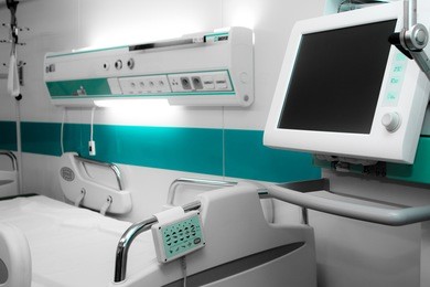 modern hospital bed with computer and monitor
