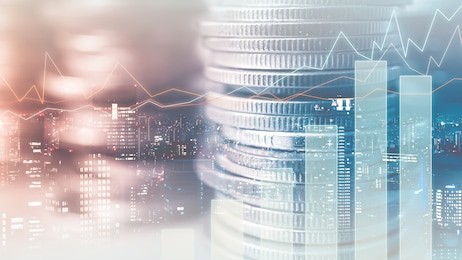 double exposure of graph and rows of coins in soft color for finance and business concept