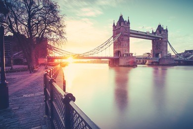 view of tower bridge at sunrise on a cold november morning in london, united kingdom.