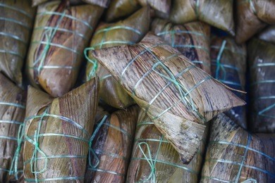 with different fillings and usually wrapped in bamboo leaves