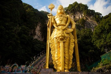 the batu caves -lord murugan statue and entrance near kuala lumpur malaysia. 