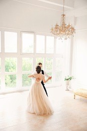 first wedding danc.wedding couple dances on the studio. wedding day. happy young bride and groom on their wedding day. 
