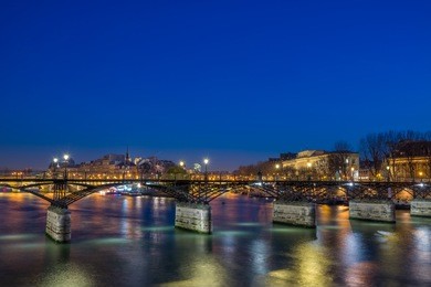 pont des arts bridge by the seine river iin paris at night