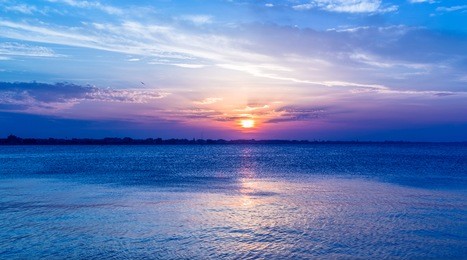 blue sunset sky over sea.intense colors. twilight landscape. sun at dusk. rimini italy