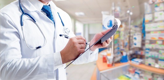 the pharmacist gives advice on medicaments. at the pharmacy