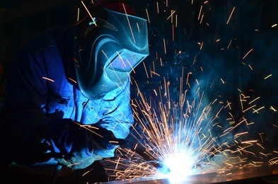 welders working at the factory made metal	