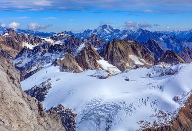 view from mt. titlis in the swiss alps in winter. mount titlis is a mountain, located on the border between the swiss cantons of obwalden and bern.